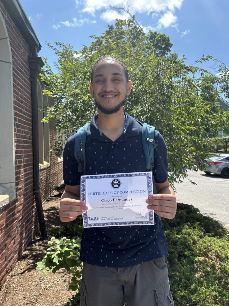 Cisco F. receives his certificate of completion from the Tufts Pre College Lab Science Program. Congratulations to Cisco!