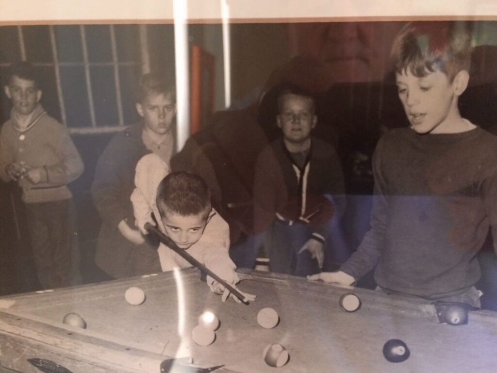 Peter Norton, South Boston Alumnus, at 8 years old playing pool